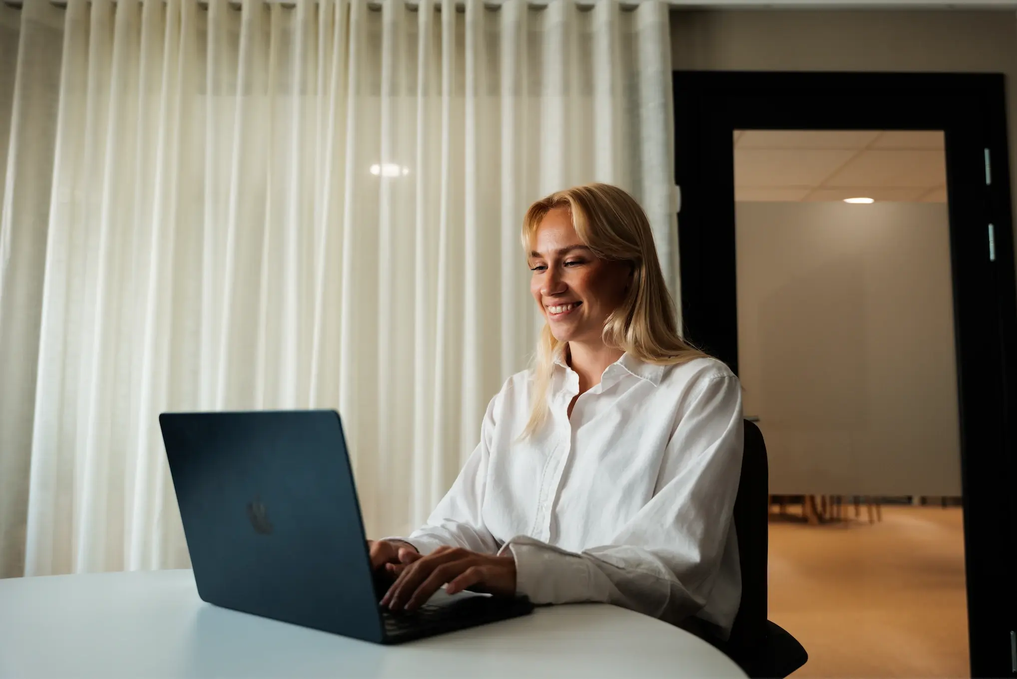 colleague sitting in front of computer